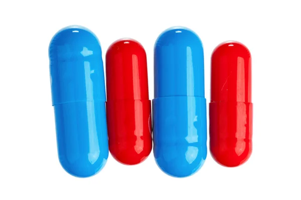 Píldoras de colores aislados en blanco — Foto de Stock