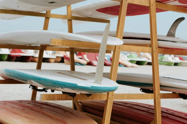 Surfboards stacked on the rack on a beach — Stock Photo, Image