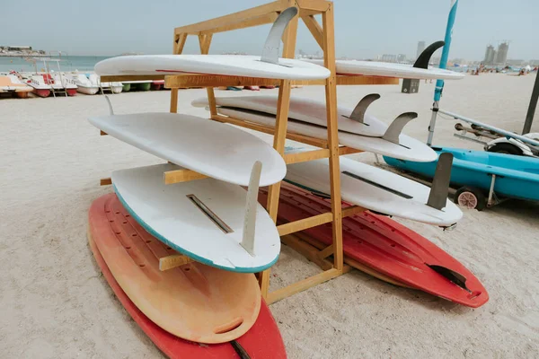 Surfboards stacked on the rack on a beach — Stock Photo, Image