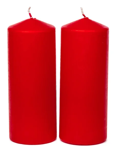 Eine Auswahl roter Kerzen auf weißem Hintergrund — Stockfoto