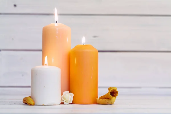 Home lighting candles on wooden table — Stock Photo, Image