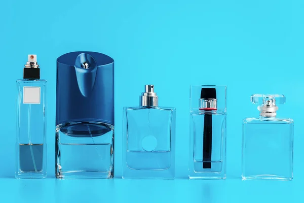 Man perfume bottle on blue background close up — Stock Photo, Image