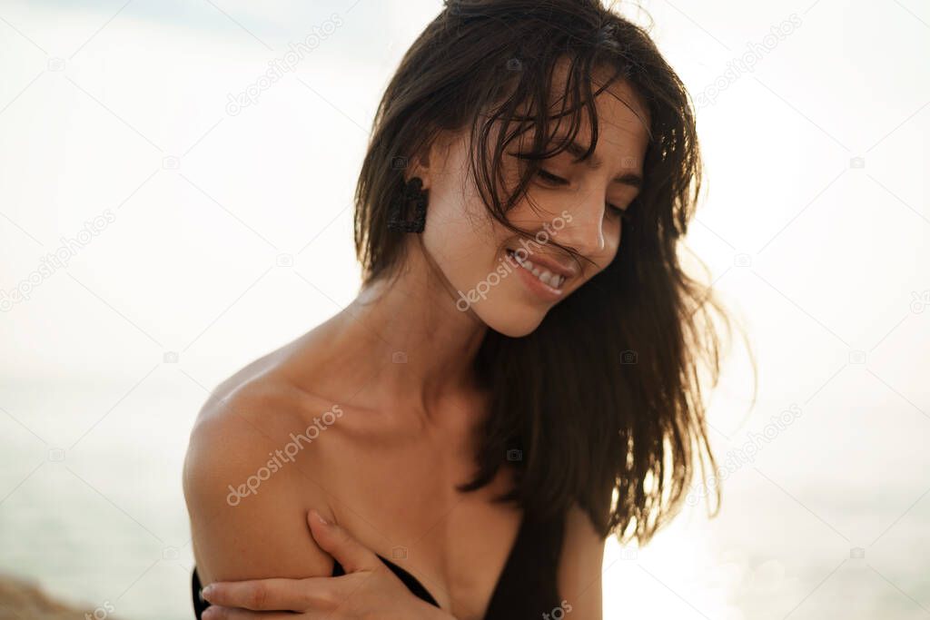 Young smiling woman outdoors portrait at beach