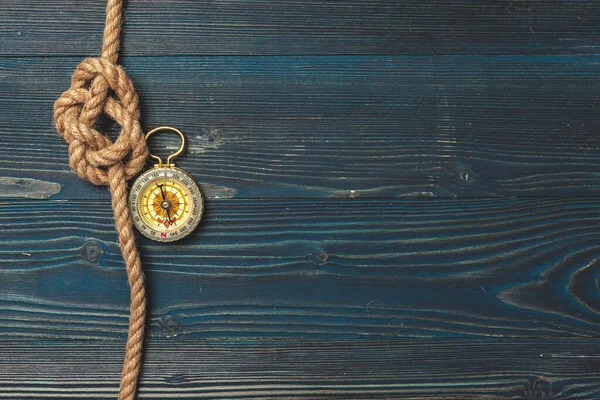 Nautical background. Sailing rope with a compass