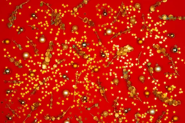 Christmas pattern of holiday decorations on red background