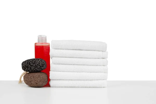 Spa still life with stacked of stone and towel isolated on white — Stock Photo, Image