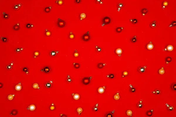 Christmas pattern of holiday decorations on red background