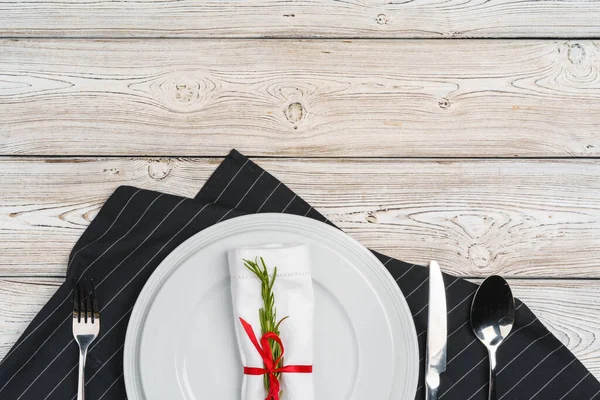 Elegant table setting with festive decor on wooden background