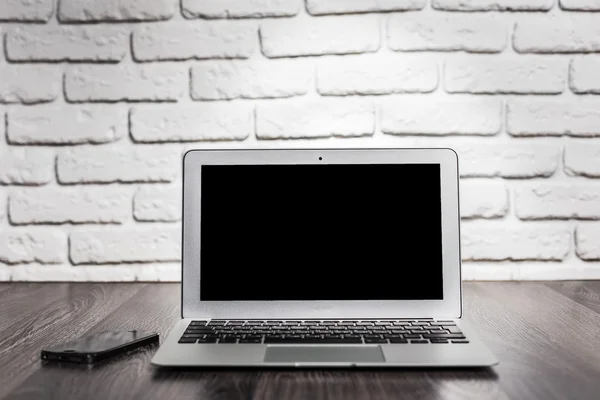 Laptop on wood table — Stock Photo, Image