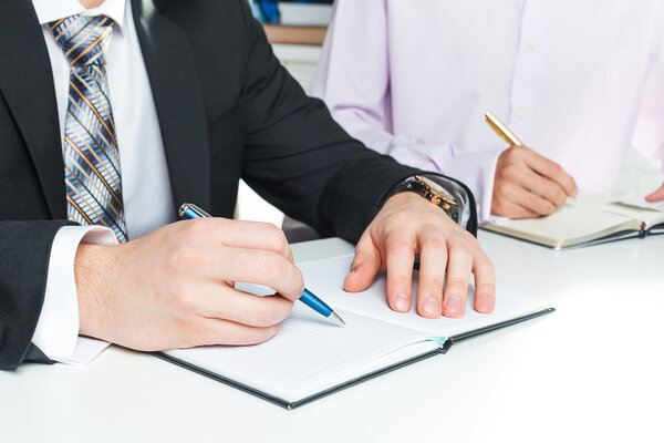 Hands of businesspeople