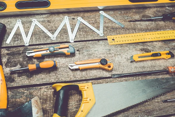 Assorted work tools on wood — Stock Photo, Image