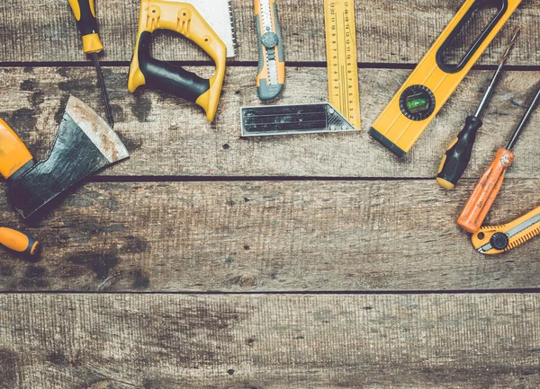 Assorted work tools on wood — Stock Photo, Image