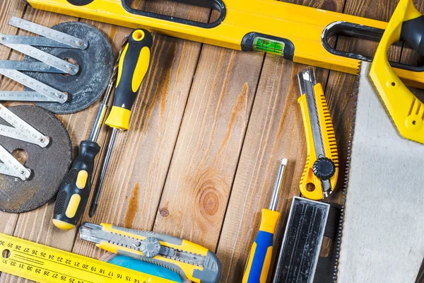 Assorted work tools on wood — Stock Photo, Image