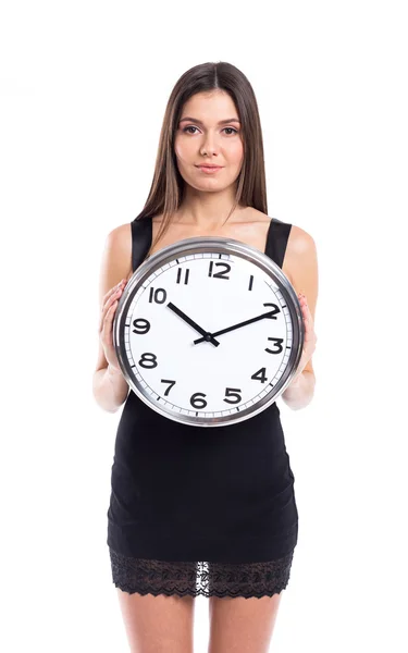 Smiley businesswoman holding clock. Royalty Free Stock Images