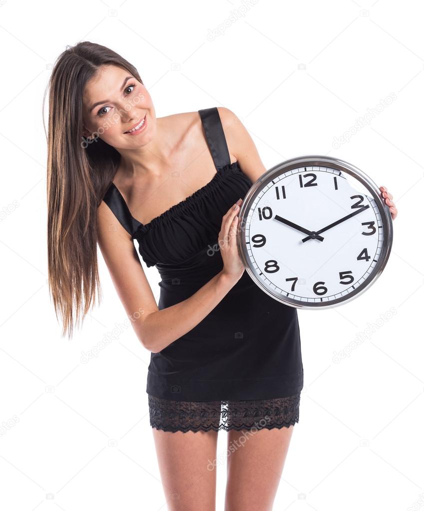 smiley businesswoman holding clock.
