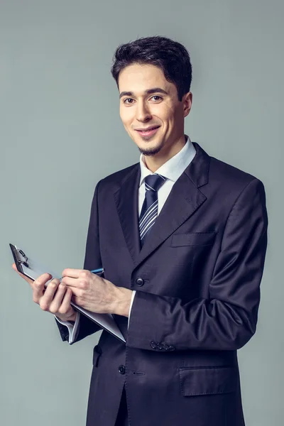 Portret van jonge gelukkig zakenman — Stockfoto