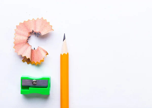 yellow pencil and green pencil sharpener