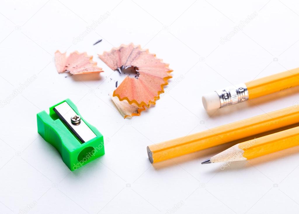 yellow pencil and green pencil sharpener