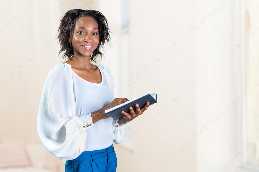 young african woman with a book