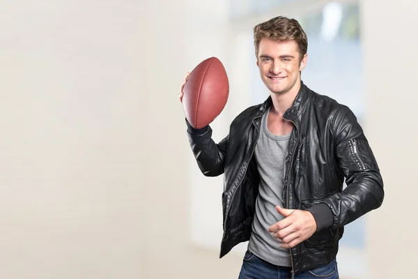 man football player portrait holding american football