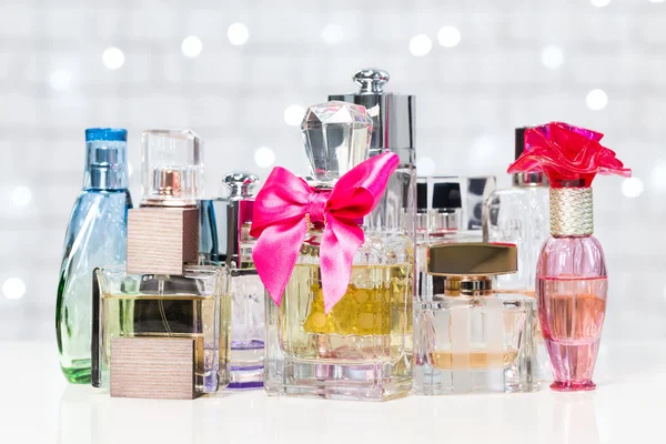 Various bottles of woman perfume