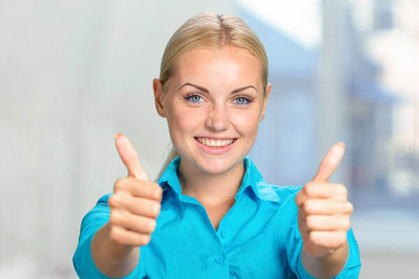 young woman with thumbs up