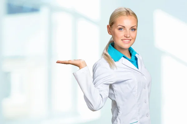 Doctor showing blank area for sign or copyspace Stock Image