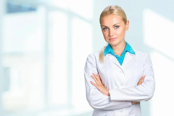 Doctor woman in medical gown Stock Picture