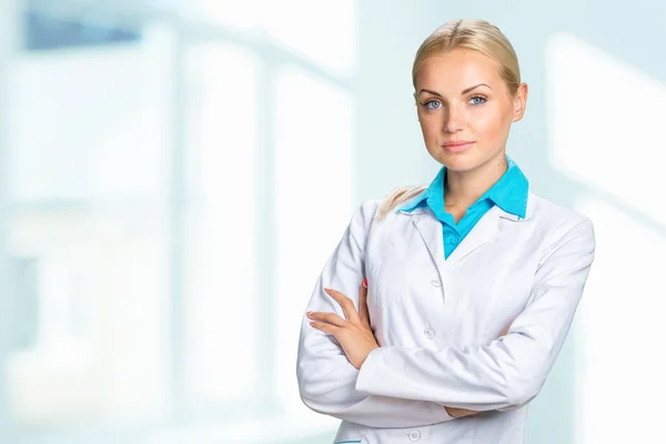 Doctor woman in medical gown Stock Picture