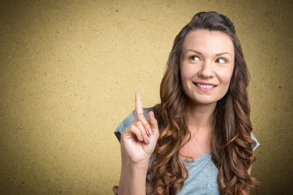 Woman with finger point up — Stock Photo, Image