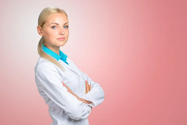 Smiling doctor woman in medical gown — Stock Photo, Image