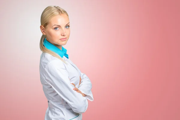 Smiling doctor woman in medical gown — Stock Photo, Image