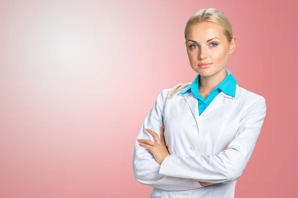 Smiling doctor woman in medical gown — Stock Photo, Image