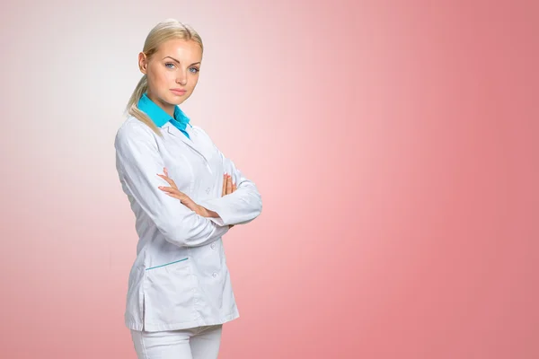 Smiling doctor woman in medical gown Royalty Free Stock Images