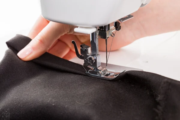 Women's hands behind her sewing — Stock Photo, Image