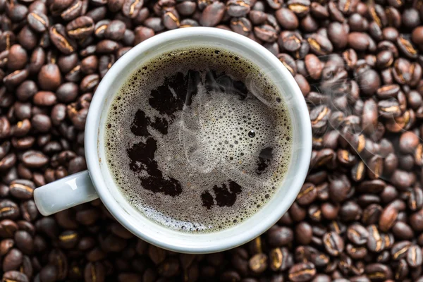 Taza de café y granos de café — Foto de Stock