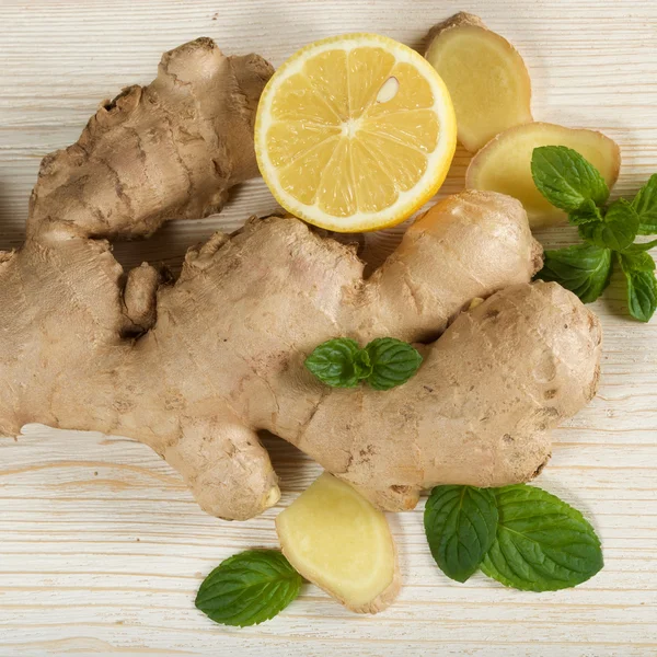 Fresh ginger on wooden background — Stock Photo, Image