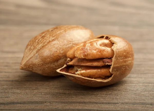 pecan nuts on wooden background