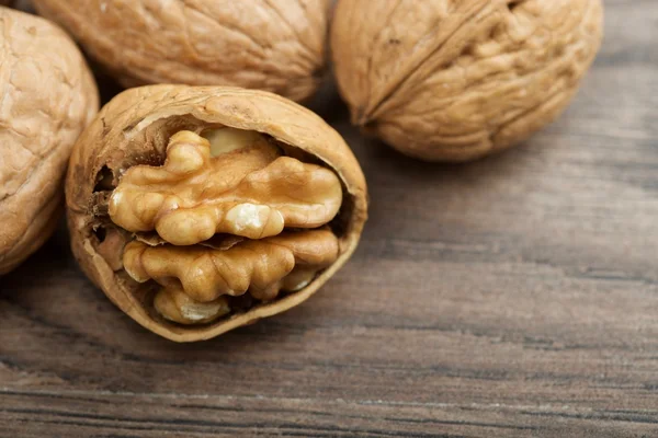 Walnuts on wooden background — Stock Photo, Image