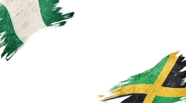 Флаги Нигерии Ямайки Белой Спине — стоковое фото