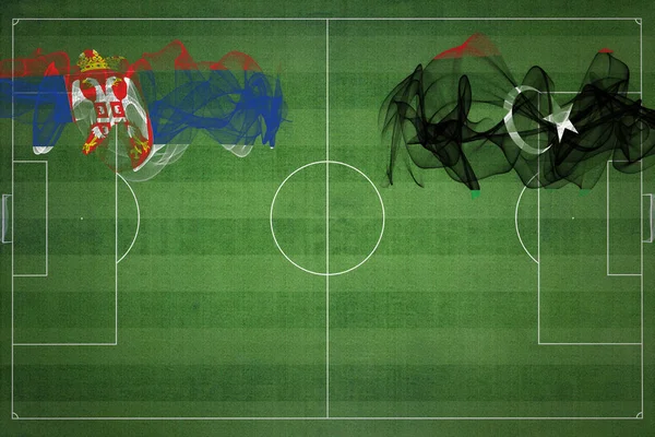 セルビアVsリビアサッカーマッチ 国の色 サッカー場 サッカーゲーム 競争の概念 コピースペース — ストック写真