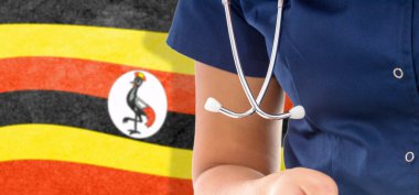 Uganda bayrağı steteskoplu kadın doktor, ulusal sağlık sistemi