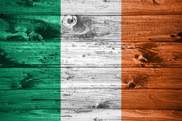 Ireland flag on wooden planks background wood flag