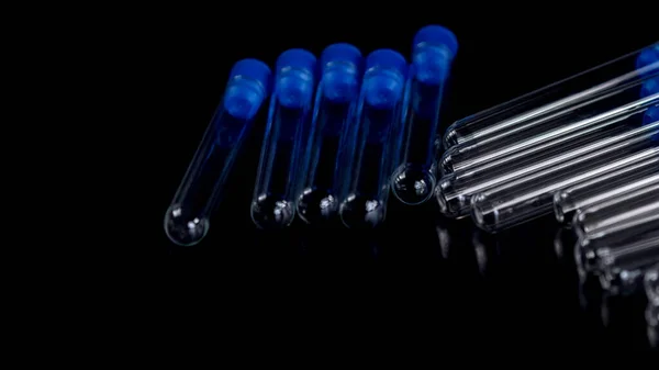 Laboratory Test Tubes on Black Background, Health care concept