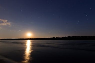 Beautiful night sky constellations Scorpius, Sagittarius, Scutum, Aguila, Sagitta, Serpens, Libra, Ophiuchus. Moon reflection on Danube river. Stars Antares, Altair, Planet Saturn. clipart