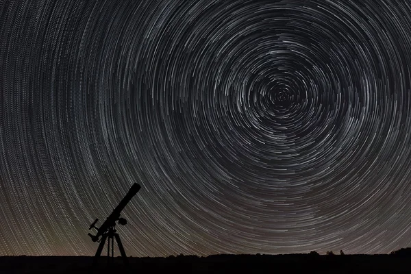 Beautiful night sky, Star trails over filed and astronomical telescope — Stock Photo, Image