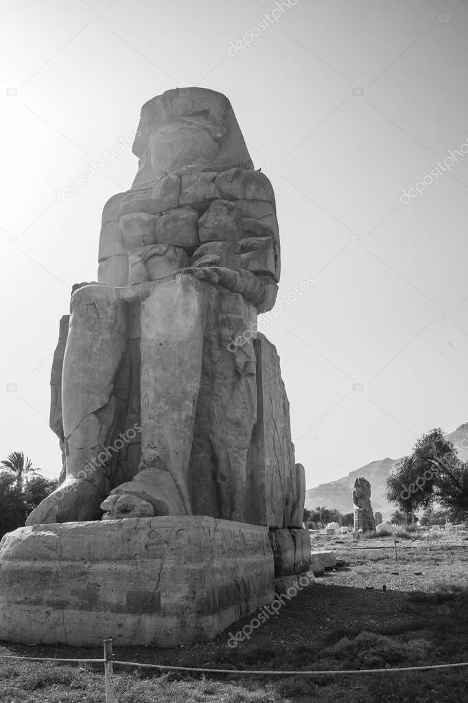 The Colossi of Memnon are  two monumental statues representing Amenhotep III (1386-1353 BCE) 