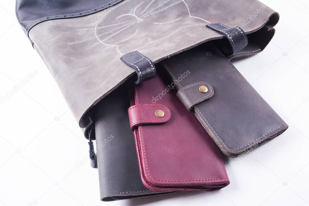 leather wallets  and bag isolated on white background