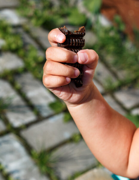 little girl holding a chocolate