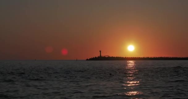 Lighthouse on gorgeous sunset background. Port of Sochi, Russia. — Stock Video